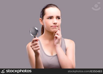 Young girl with magnifying glass