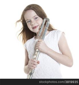young girl with red hair and missing teeth holding flute in studio against white background