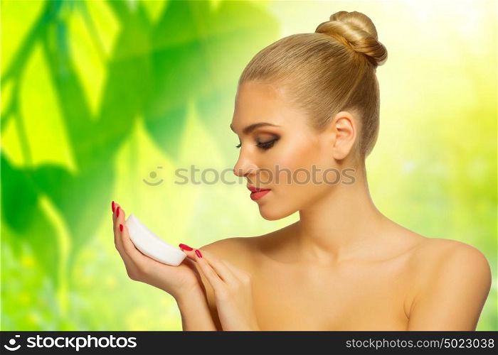 Young girl with soap on floral background