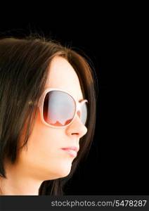 Young girl with sunglasses isolated on black