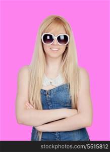 Young girl with sunglasses on a over pink background