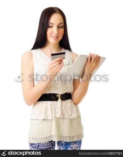 Young girl with tablet PC and credit card isolated
