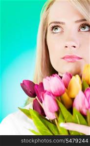 Young girl with tulips against colourful background