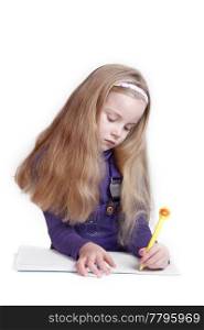 young girl writes with yellow pen isolated on white