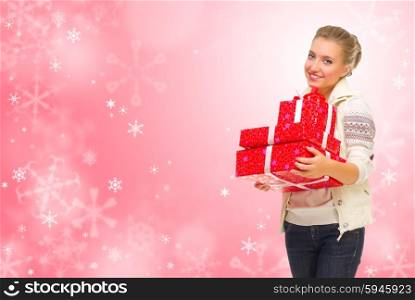 Young girl wth gift boxes on red winter background