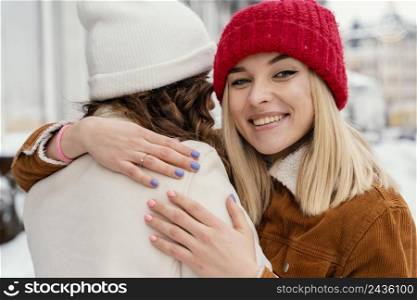 young girlfriends hugging 2
