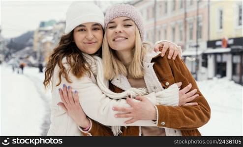 young girlfriends outdoor hugging 3