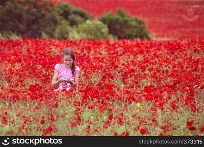 young girls at the poppies field