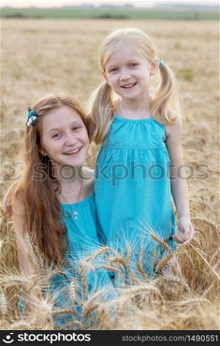 young girls joys on the wheat field