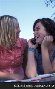 Young Girls Laughing and Talking on Cell Phone