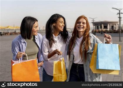 young girls taking walk after shopping