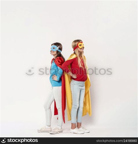 young girls wearing superhero costume