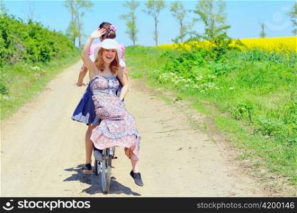Young girls with a vintage bicycle