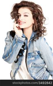 young gorgeous brunette model in jeans jacket, studio shot