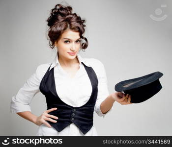 young gorgeous brunette posing with hat, studio shot