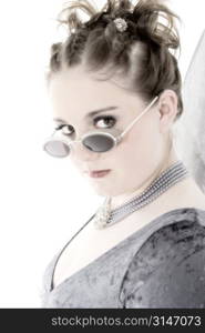 Young goth teen looking at camera. Shot in studio over white.