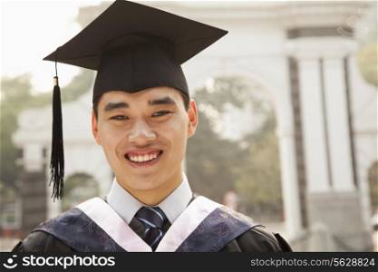 Young Graduate in Cap and Gown