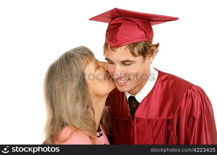 Young graduate receiving a kiss from his mother. Isolated on white.