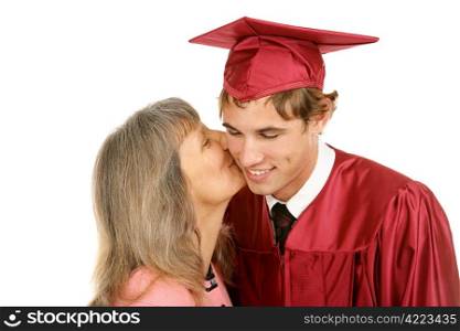 Young graduate receiving a kiss from his mother. Isolated on white.