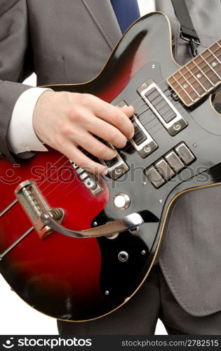 Young guitar player isolated on white