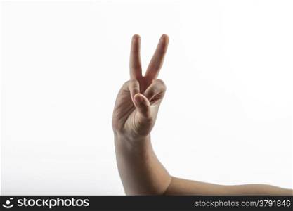 Young hands make a 2 fingers gesture