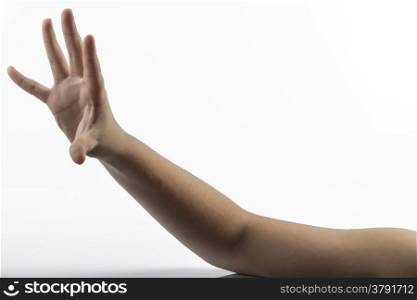 Young hands makes a gesture in rock-paper-scissors game: paper sign