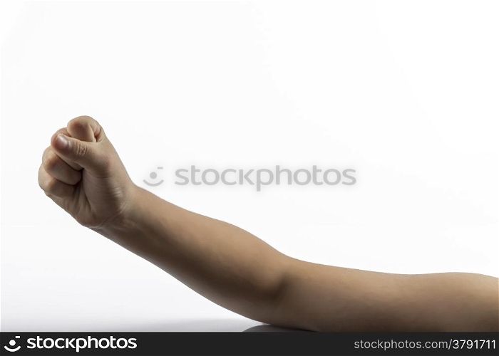 Young hands makes a gesture in rock-paper-scissors game: rock sign