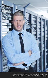 young handsome business man engeneer in datacenter server room