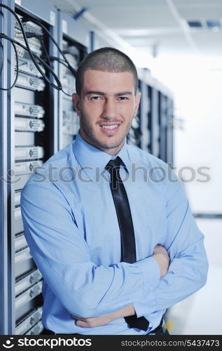 young handsome business man engeneer in datacenter server room