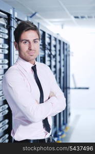 young handsome business man engeneer in datacenter server room