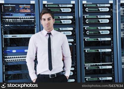 young handsome business man engeneer in datacenter server room