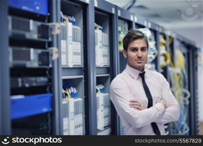 young handsome business man engeneer in datacenter server room