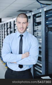 young handsome business man engineer in datacenter server room