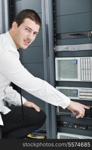 young handsome business man it engeneer in datacenter server room