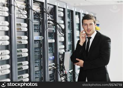 young handsome business man it engeneer in datacenter server room