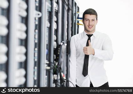 young handsome business man it engeneer in datacenter server room