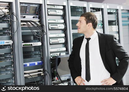 young handsome business man it engeneer in datacenter server room