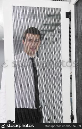 young handsome business man it engeneer in datacenter server room