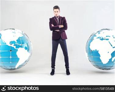 Young handsome businessman and Earth globe