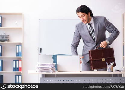 Young handsome businessman employee in the office 