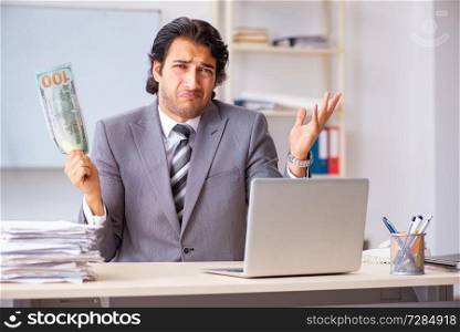 Young handsome businessman employee sitting in the office . Young handsome businessman employee sitting in the office
