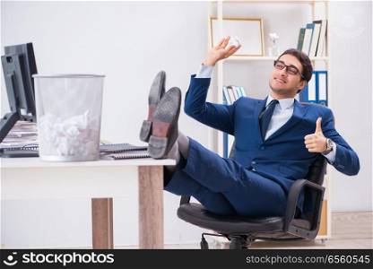 Young handsome businessman employee working in office in paperwo. Young handsome businessman employee working in office in paperwork concept