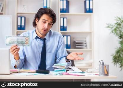 Young handsome businessman in budget planning concept