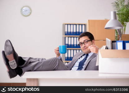 Young handsome businessman moving offices