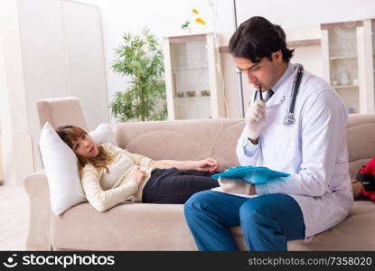 Young handsome doctor visiting female patient at home 