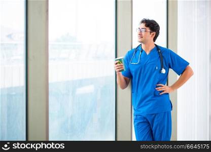 Young handsome doctor working in the hospital . The young handsome doctor working in the hospital 