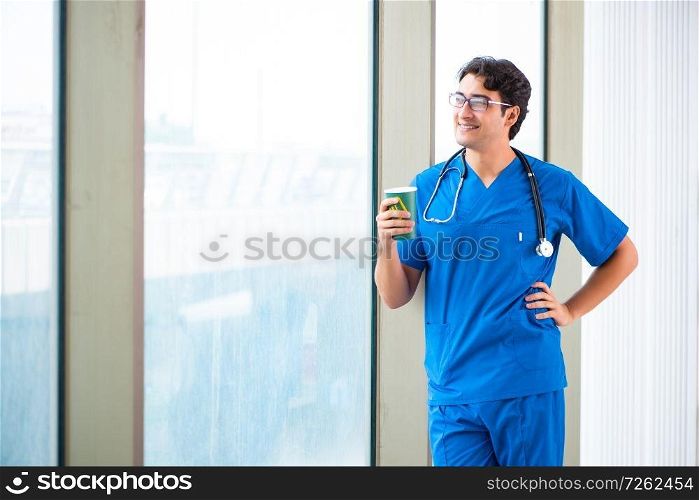 Young handsome doctor working in the hospital . The young handsome doctor working in the hospital 