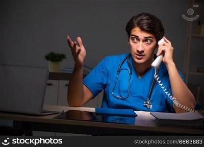 Young handsome doctor working night shift in hospital   . The young handsome doctor working night shift in hospital   