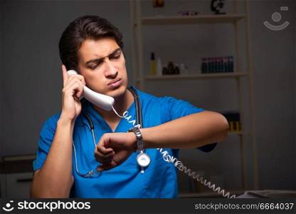 Young handsome doctor working night shift in hospital   . The young handsome doctor working night shift in hospital   