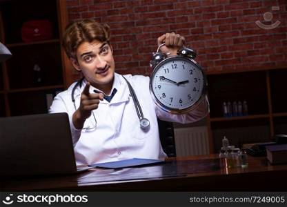 Young handsome doctor working night time at the hospital . The young handsome doctor working night time at the hospital 